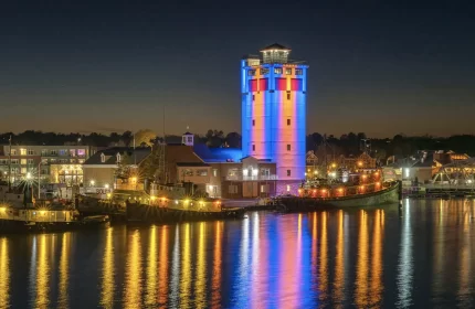 Door County Maritime Museum - Jim Kress Tower Lit at Night with Reflection on Water