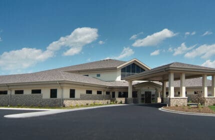 Primary Care Associates - Exterior of Building with Circle Drive, Parking Lot, Covered Entrance from Angle