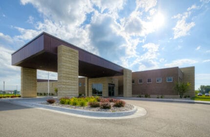 ThedaCare Physicans - Darboy Clinic - Exterior of Building with Covered Entrance and Circle Drive with Plantings