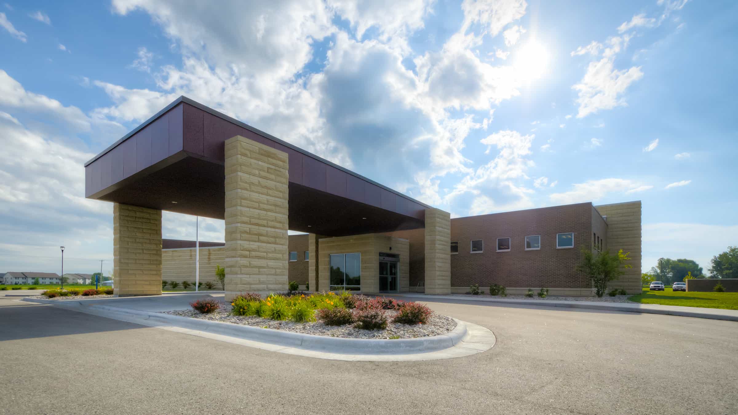 ThedaCare Physicans - Darboy Clinic - Exterior of Building with Covered Entrance and Circle Drive with Plantings